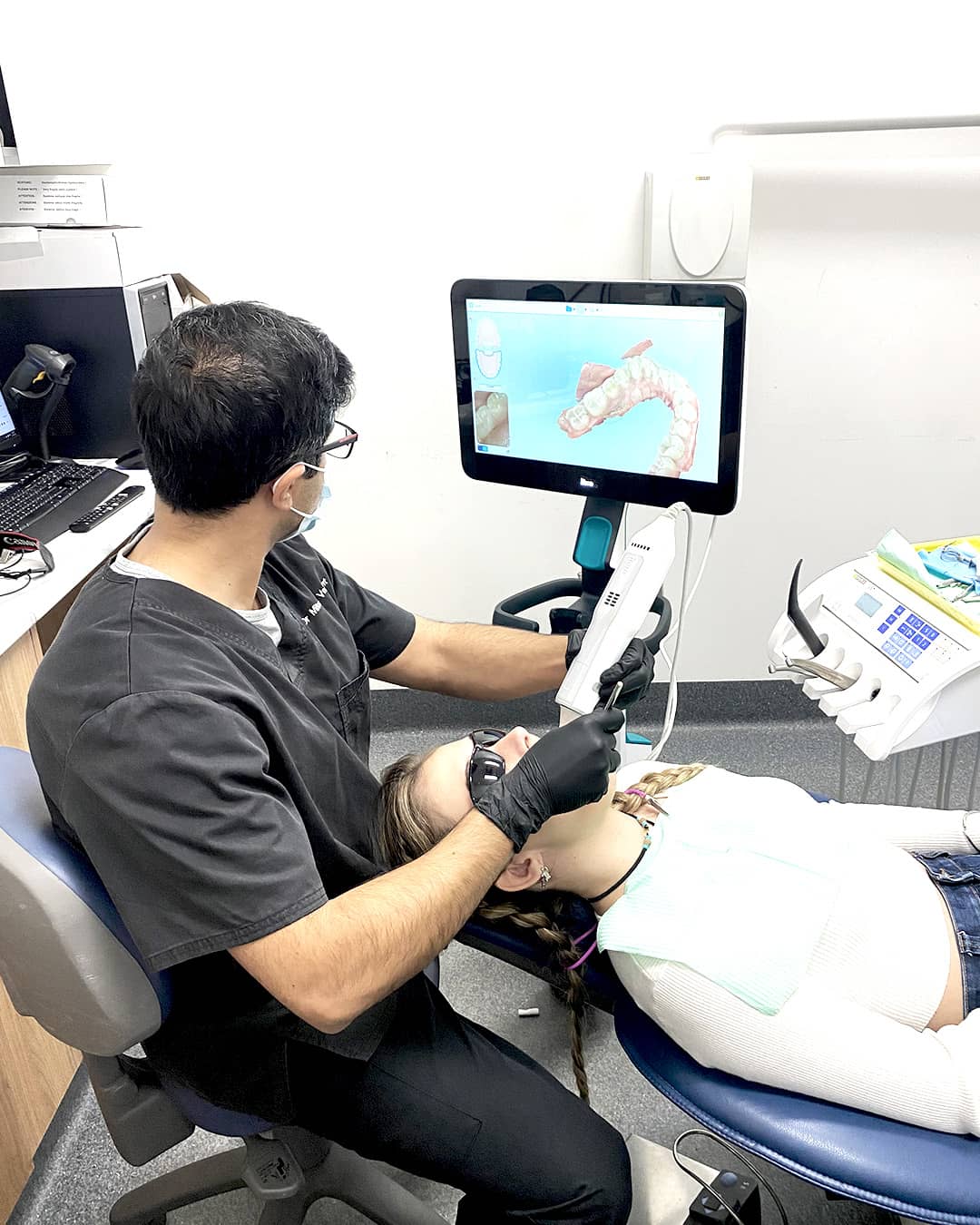 Dr. Mitesh using 3D scanner for clear aligner treatment