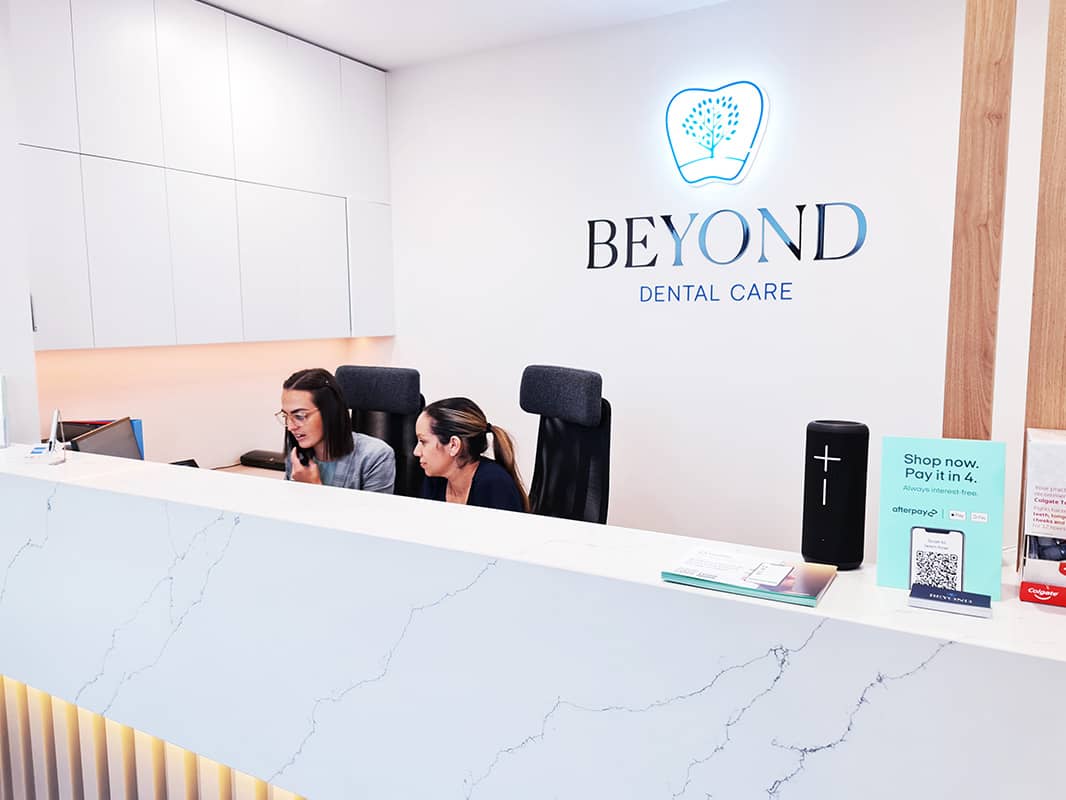 Our friendly front desk team assists a patient with scheduling, ensuring they find a convenient appointment time that fits their busy lifestyle