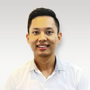 Dr. PA Zaw smiling in a white collared shirt, professional headshot for Hamilton dental team