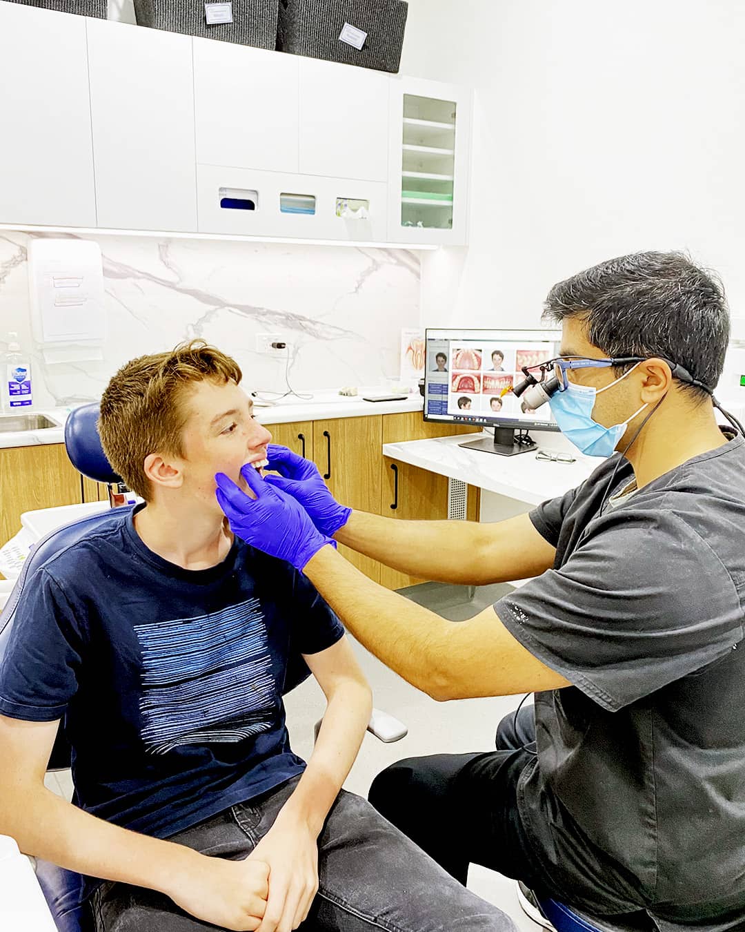 Dr. Mitesh examining clear aligner progress