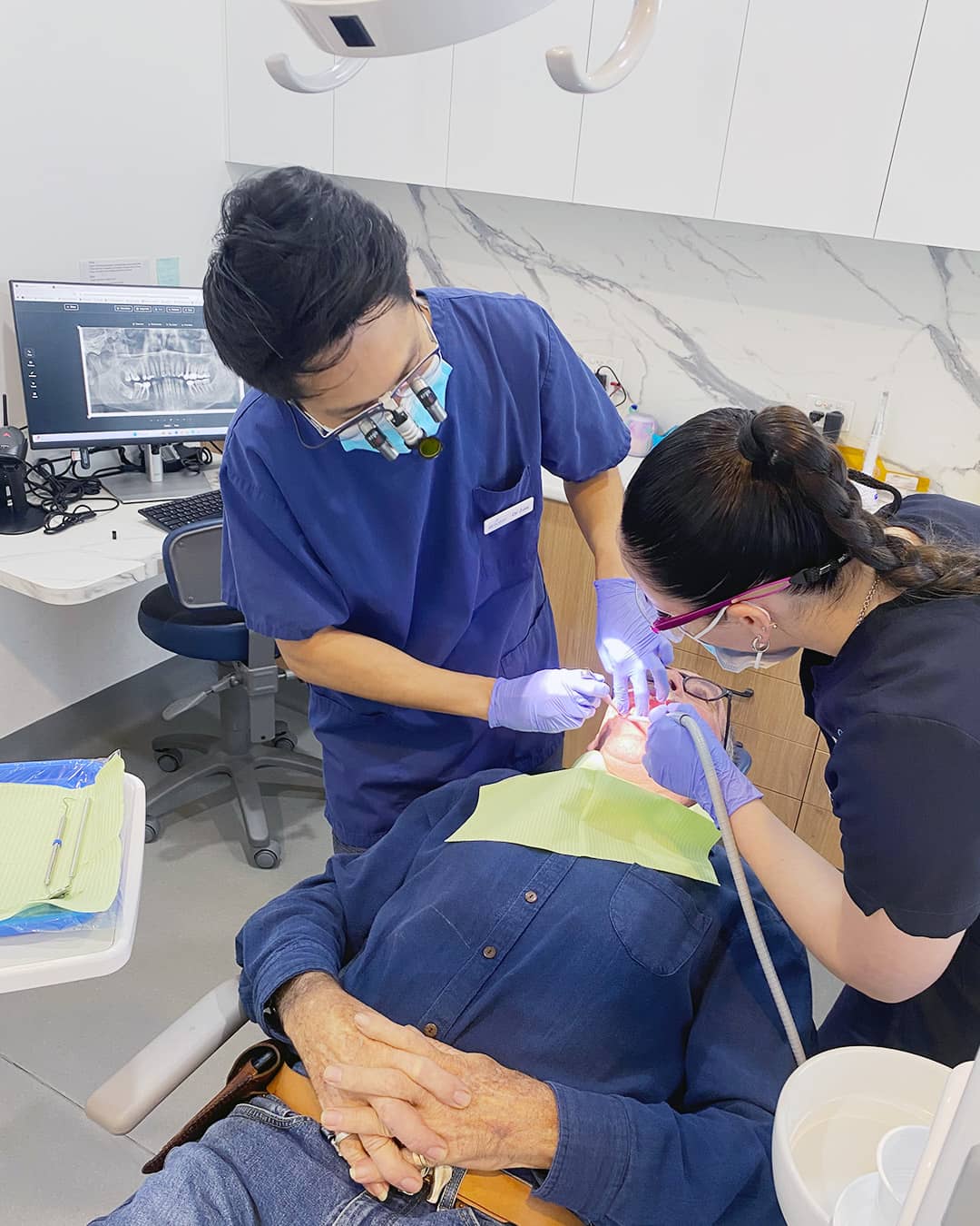 Dr. PA Zaw providing dental care