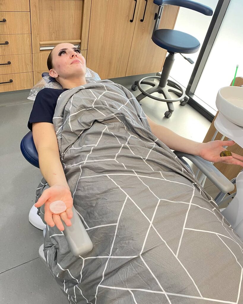 A patient finds relaxation holding smooth crystal palm stones in our calming dental environment to ease anxiety. This complimentary relaxation technique is available to you at our Bribie Island dental practice