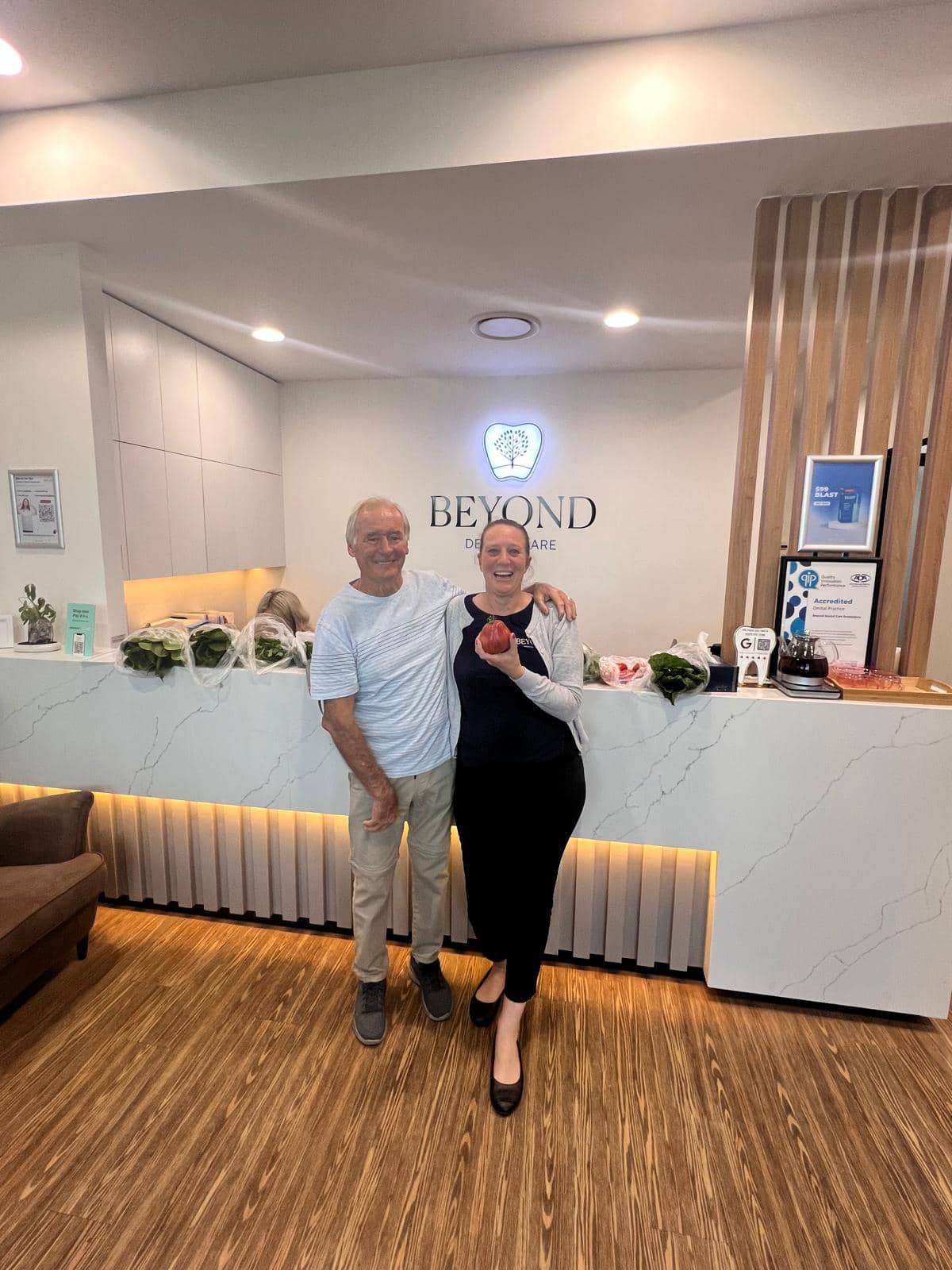 Practice manager Brooke Lilley with a patient at Beyond Dental Care Burpengary reception