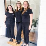 Our three lovely practice managers welcoming patients at the entrance of our Hamilton dental clinic in Brisbane.
